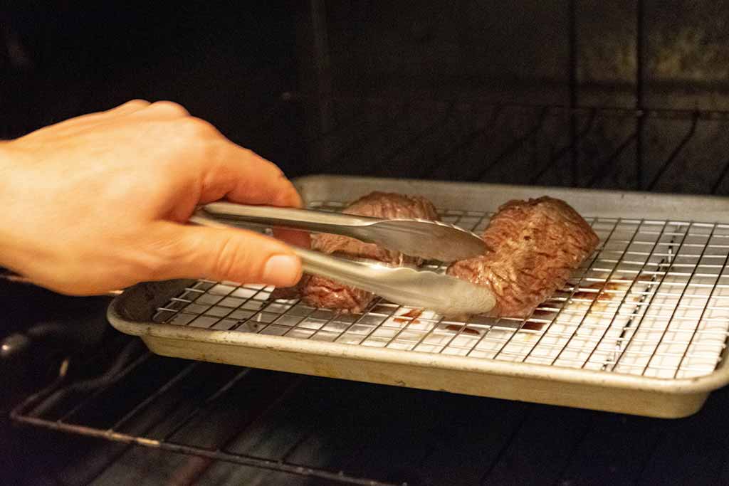 Mouthwatering Steak - Turning The Beef Cooking Steak Medium Rare In Oven